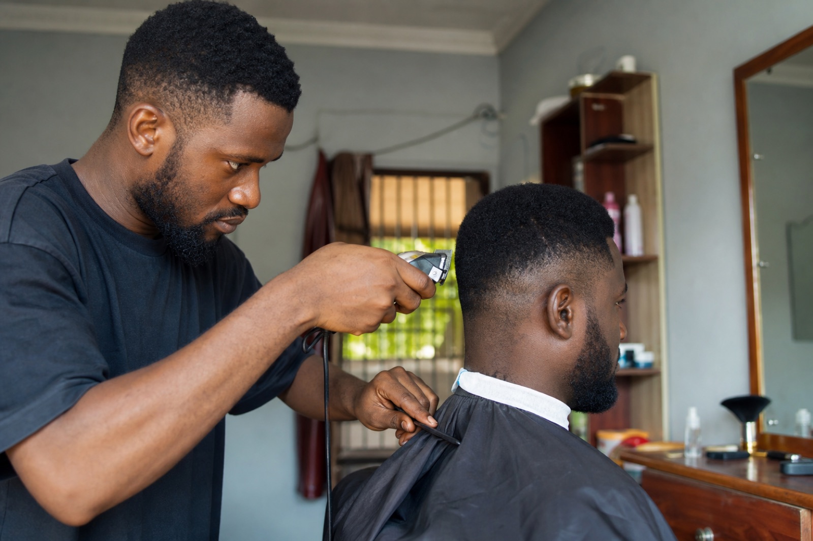 Barber giving a client a haircut